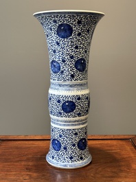 A Chinese blue and white 'chrysanthemum scroll' 'gu' vase, Kangxi