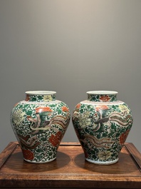 A pair of Chinese wucai 'phoenix and peony scroll' vases, Transitional period