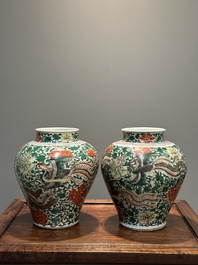 A pair of Chinese wucai 'phoenix and peony scroll' vases, Transitional period