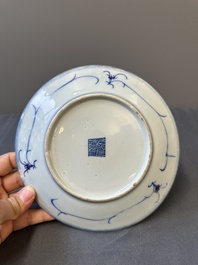 A pair of Chinese blue and white Canton-decorated plates, a famille rose 'playing boys' plate and a reticulated plate, 19th C.