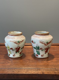 A pair of small Chinese wucai jars with figures in a landscape, Transitional period