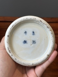 A pair of Chinese blue and white covered vases and three jars, 19th C.