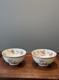 A pair of Chinese iron-red-decorated and gilt bowls with relief design, Kangxi