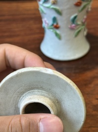 A pair of Chinese famille rose covered vases and a plate with applied floral design, Yongzheng