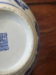 A pair of Chinese blue and white covered vases and three jars, 19th C.