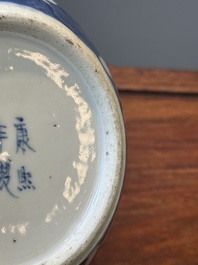 A pair of Chinese blue and white covered vases and three jars, 19th C.