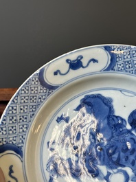 A pair of Chinese blue and white 'Buddhist lion' plates, ding mark, Kangxi