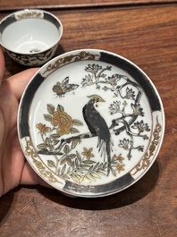 A pair of Chinese grisaille and gilt 'pheasant' cups and saucers, Yongzheng