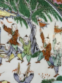 A pair of Chinese blue and white Canton-decorated plates, a famille rose 'playing boys' plate and a reticulated plate, 19th C.