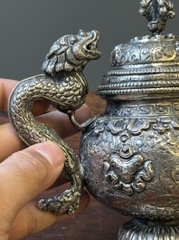 A fine Tibetan silver plated 'bajixiang' teapot, 19th C.
