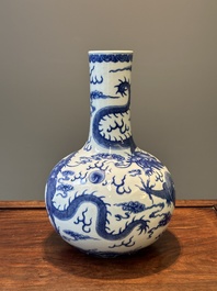 A Chinese blue and white 'dragon' bottle vase, Yongzheng mark, 19th C.