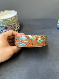 A pair of Chinese famille rose four-tier stacking boxes and a teapot, 19th C.