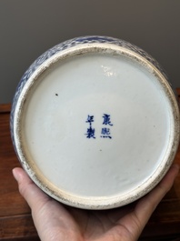 A pair of Chinese blue and white jars and a vase, Kangxi mark, 19th C.