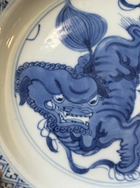 A pair of Chinese blue and white 'Buddhist lion' plates, ding mark, Kangxi