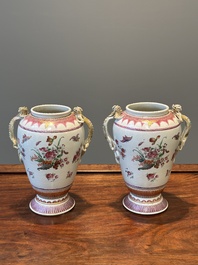 A pair of Chinese famille rose 'cornucopia' vases with chilong handles, Qianlong