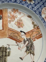 A pair of Chinese Imari-style plates with a merchant, lady and boy, Yongzheng