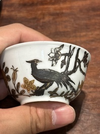 A pair of Chinese grisaille and gilt 'pheasant' cups and saucers, Yongzheng