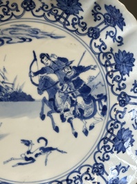 A pair of Chinese blue and white 'Mongolian hunting scene' plates and a pair of plates with floral design, Chenghua and Kangxi mark, Kangxi