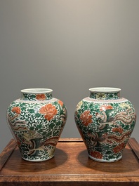 A pair of Chinese wucai 'phoenix and peony scroll' vases, Transitional period