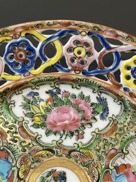A pair of Chinese blue and white Canton-decorated plates, a famille rose 'playing boys' plate and a reticulated plate, 19th C.