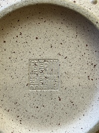 A large Chinese Yixing stoneware bowl with relief design, Qianlong mark, 18/19th C.