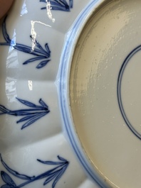 A pair of Chinese blue and white 'Mongolian hunting scene' plates and a pair of plates with floral design, Chenghua and Kangxi mark, Kangxi