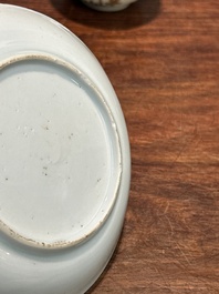 A pair of Chinese grisaille and gilt 'pheasant' cups and saucers, Yongzheng