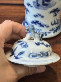 A pair of Chinese blue and white covered vases and three jars, 19th C.