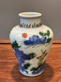 A small Chinese wucai jar with figures in a landscape, Transitional period