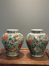 A pair of Chinese wucai 'phoenix and peony scroll' vases, Transitional period