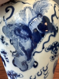 A pair of Chinese blue and white covered vases and three jars, 19th C.