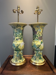 A pair of Chinese verte biscuit 'gu' vases with gilt bronze lamp mounts, 19th C.