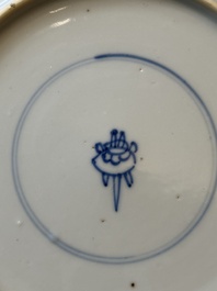 A pair of Chinese blue and white 'Buddhist lion' plates, ding mark, Kangxi