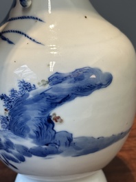 A Chinese blue, white and copper-red vase with warriors on horseback, Qianlong mark, 19th C.