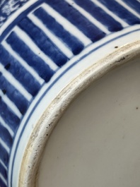 A pair of Chinese blue and white jars and a vase, Kangxi mark, 19th C.