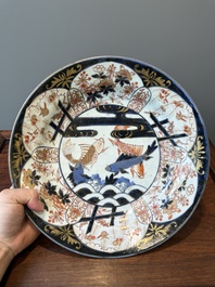 A Japanese Imari dish with carps among waves and clouds, Edo, 17th C.