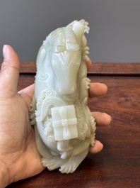 A Chinese celadon jade sculpture of a mythical horse, 18th C.