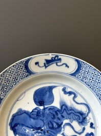 A pair of Chinese blue and white 'Buddhist lion' plates, ding mark, Kangxi