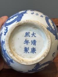 A pair of Chinese blue and white covered vases and three jars, 19th C.