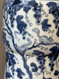 Two Chinese blue and white 'gu' vases with squirrels among grape vines, Kangxi