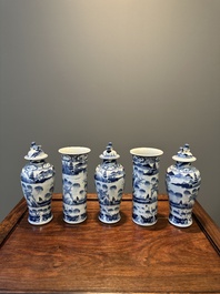 A Chinese blue and white garniture of five vases with landscape design, 19th C.