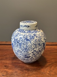 A pair of Chinese blue and white covered vases and three jars, 19th C.