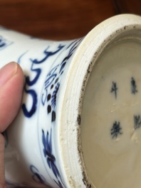 A pair of Chinese blue and white covered vases and three jars, 19th C.