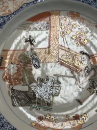 A pair of Chinese Imari-style plates with a merchant, lady and boy, Yongzheng