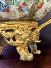 A Chinese Canton famille rose reticulated basket on stand and a bowl with gilt bronze mounts, 19th C.