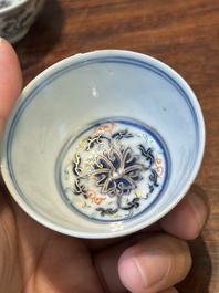 A pair of Chinese doucai 'lotus scroll' cups, Guangxu mark and of the period