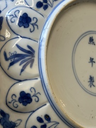 A pair of Chinese blue and white 'Mongolian hunting scene' plates and a pair of plates with floral design, Chenghua and Kangxi mark, Kangxi