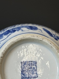 A pair of Chinese blue and white covered vases and three jars, 19th C.