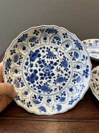 A pair of Chinese blue and white 'Mongolian hunting scene' plates and a pair of plates with floral design, Chenghua and Kangxi mark, Kangxi