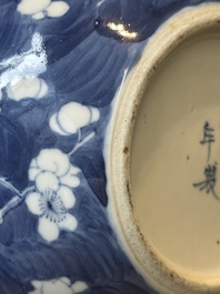 A pair of Chinese blue and white covered vases and three jars, 19th C.